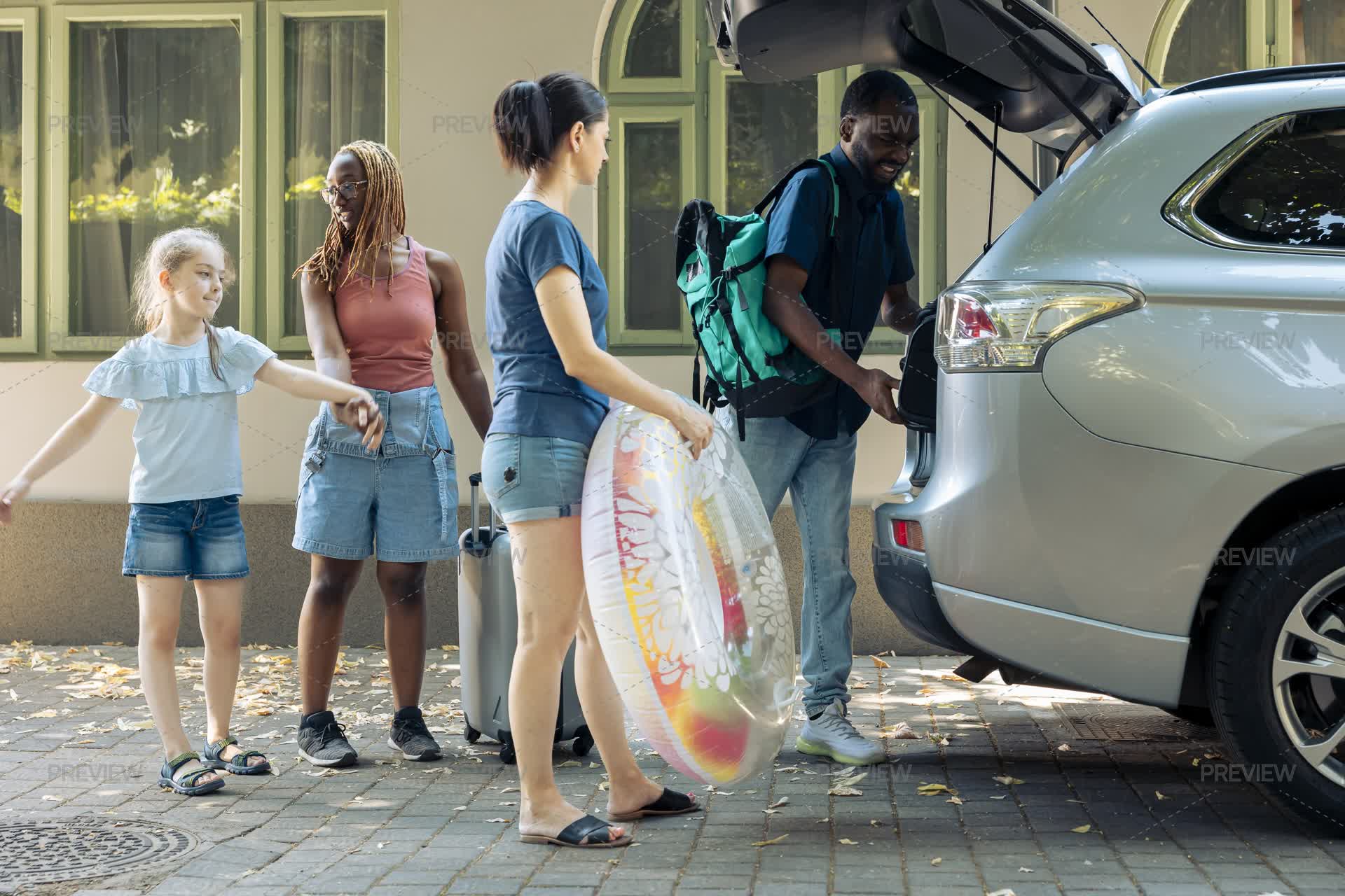 Family Putting Luggage In Vehicle - Stock Photos | Motion Array