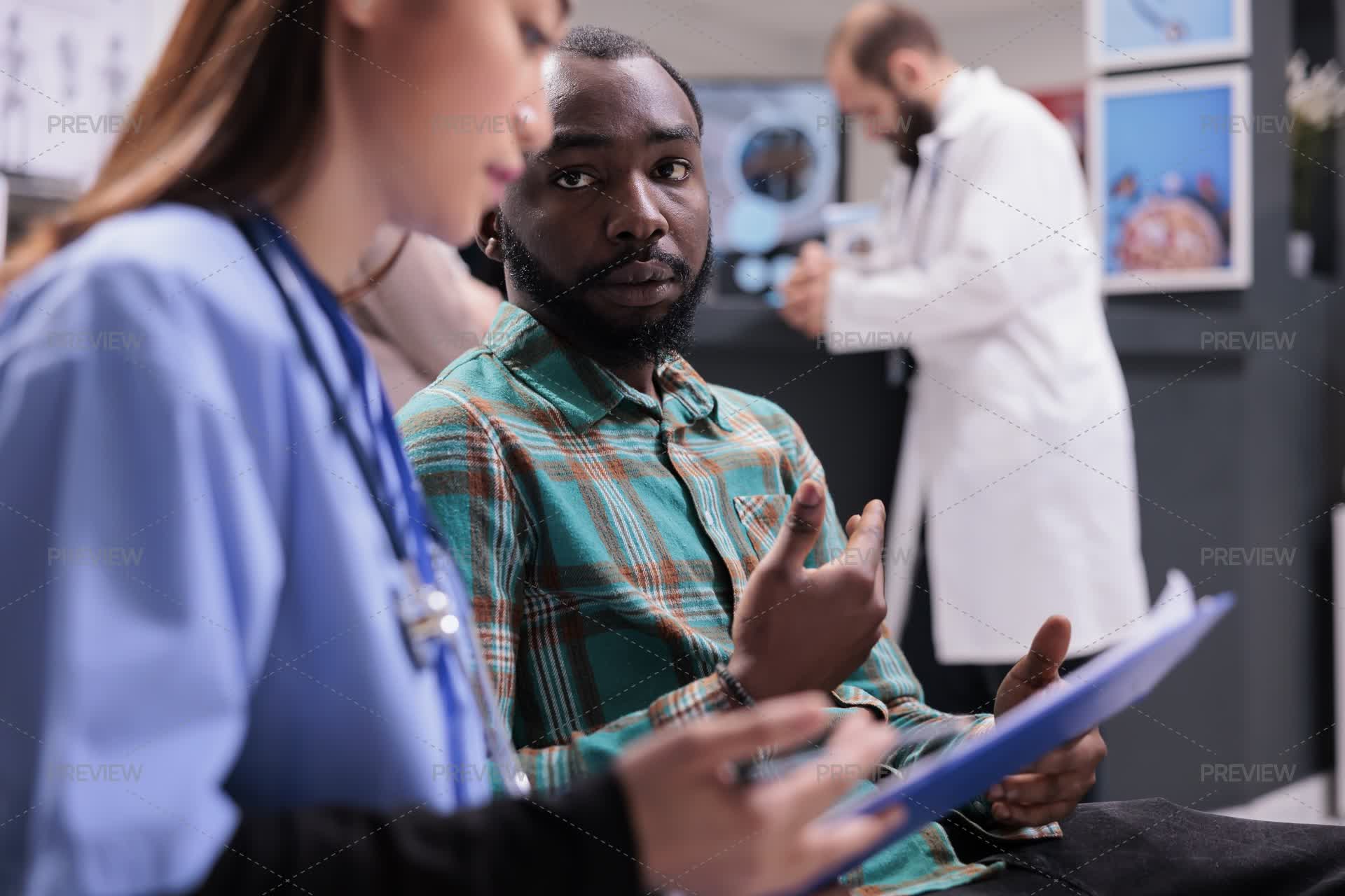 Explaining Diagnoses Nurse Explaining Diagnosis To Patient - Stock Photos | Motion Array
