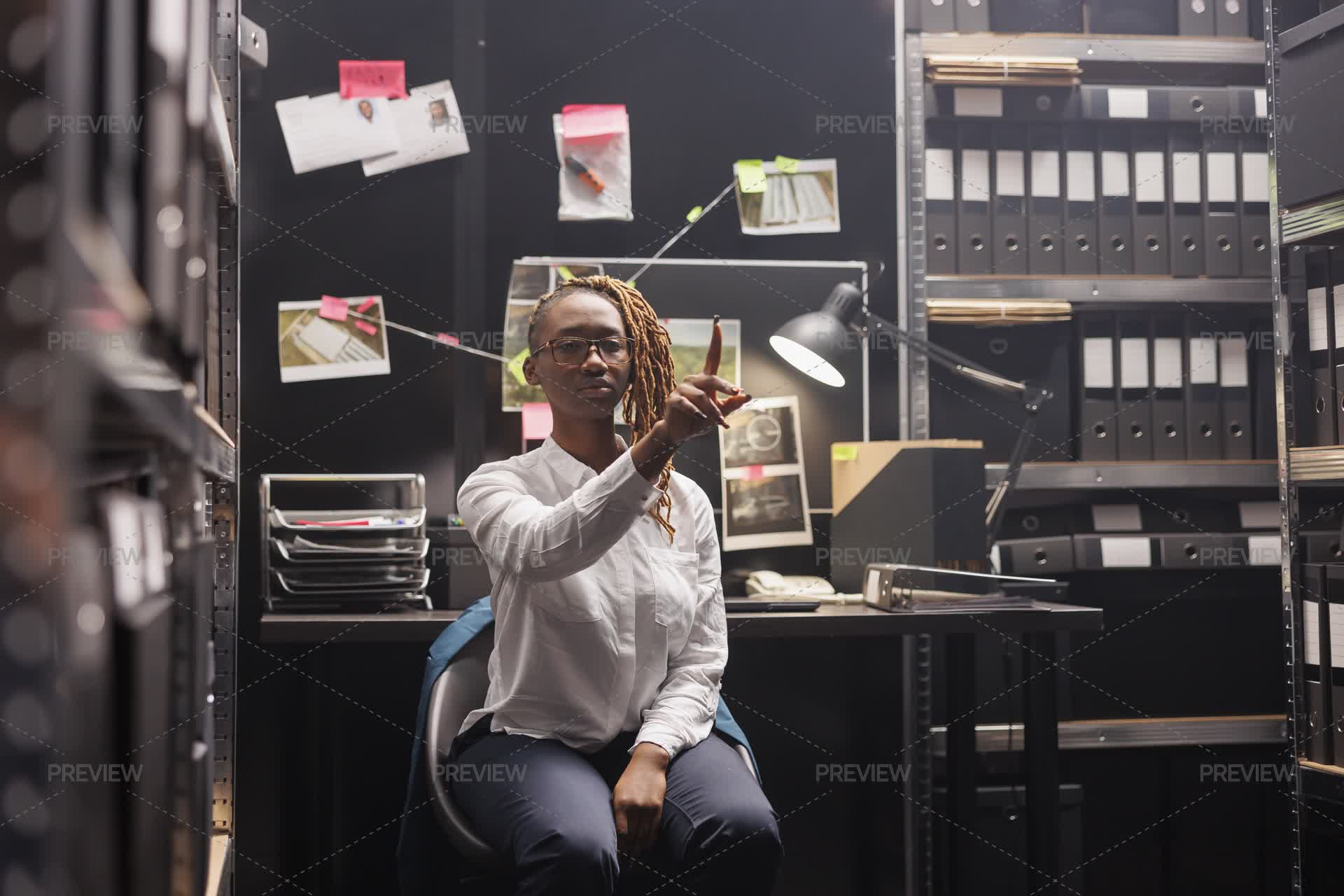 Police Detective Analyzing Evidence - Stock Photos | Motion Array