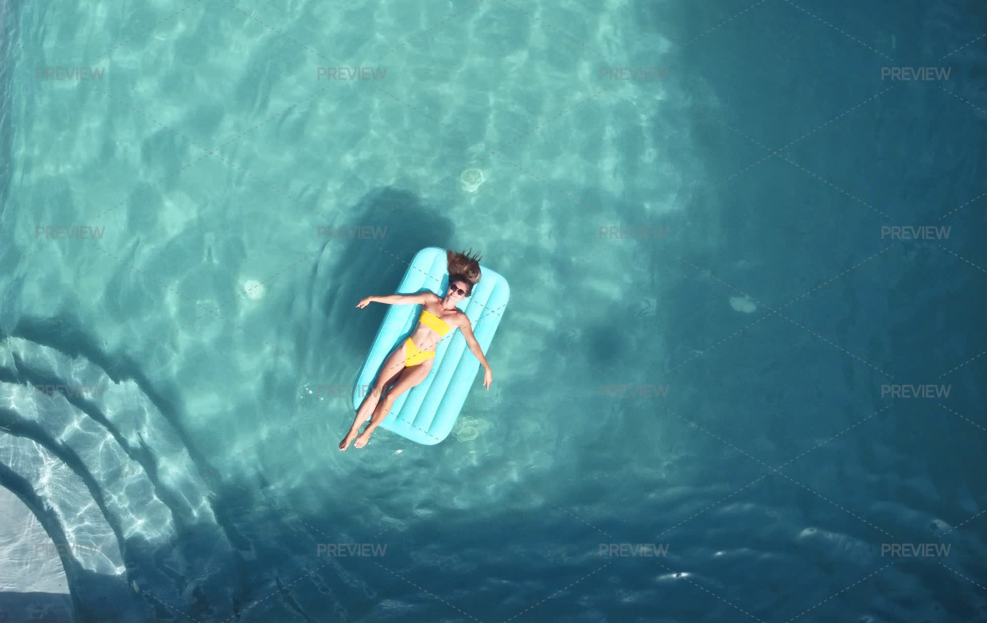 Woman Lying On Pool Float - Stock Photos | Motion Array