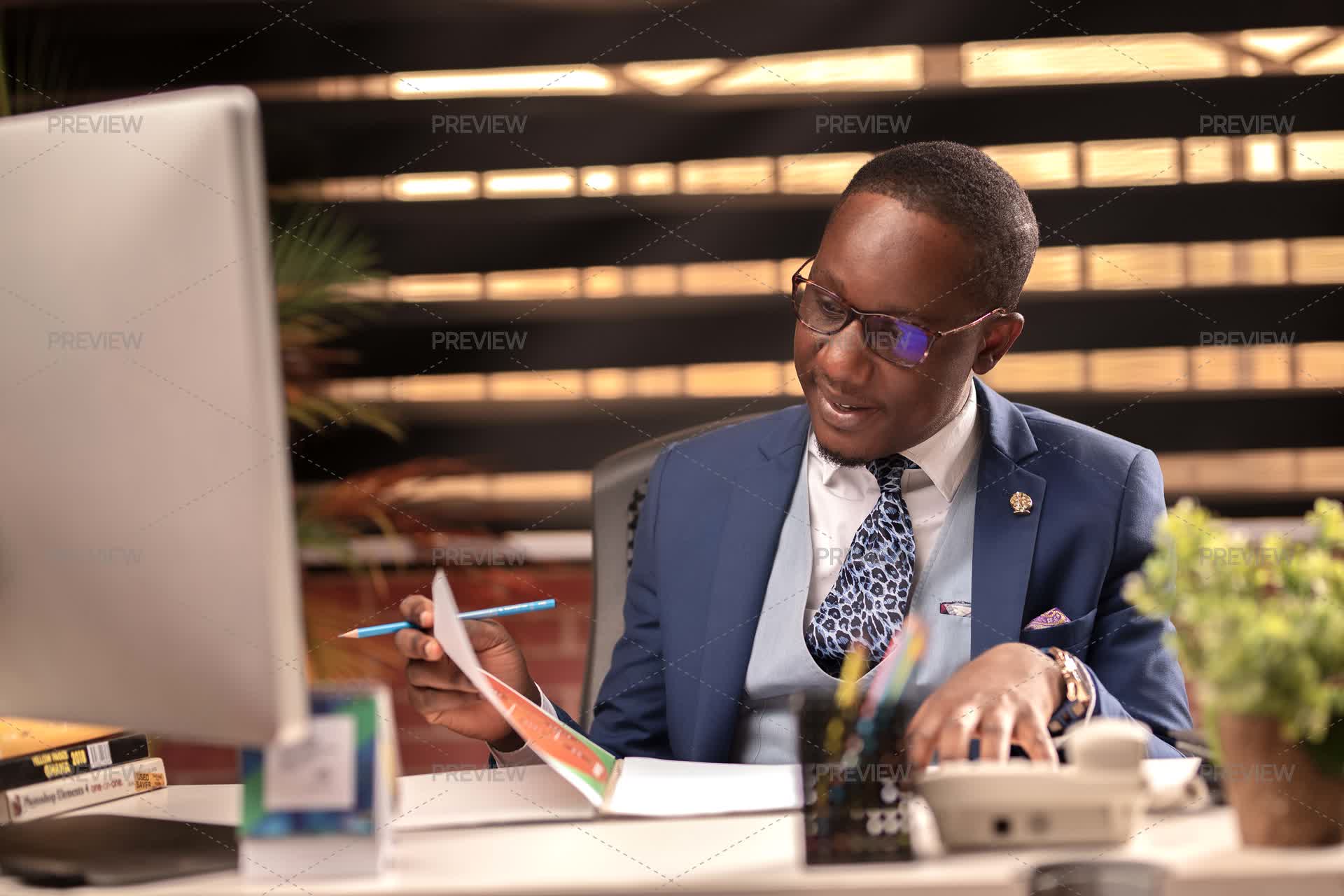 Business Man Overlooking Paperwork - Stock Photos | Motion Array