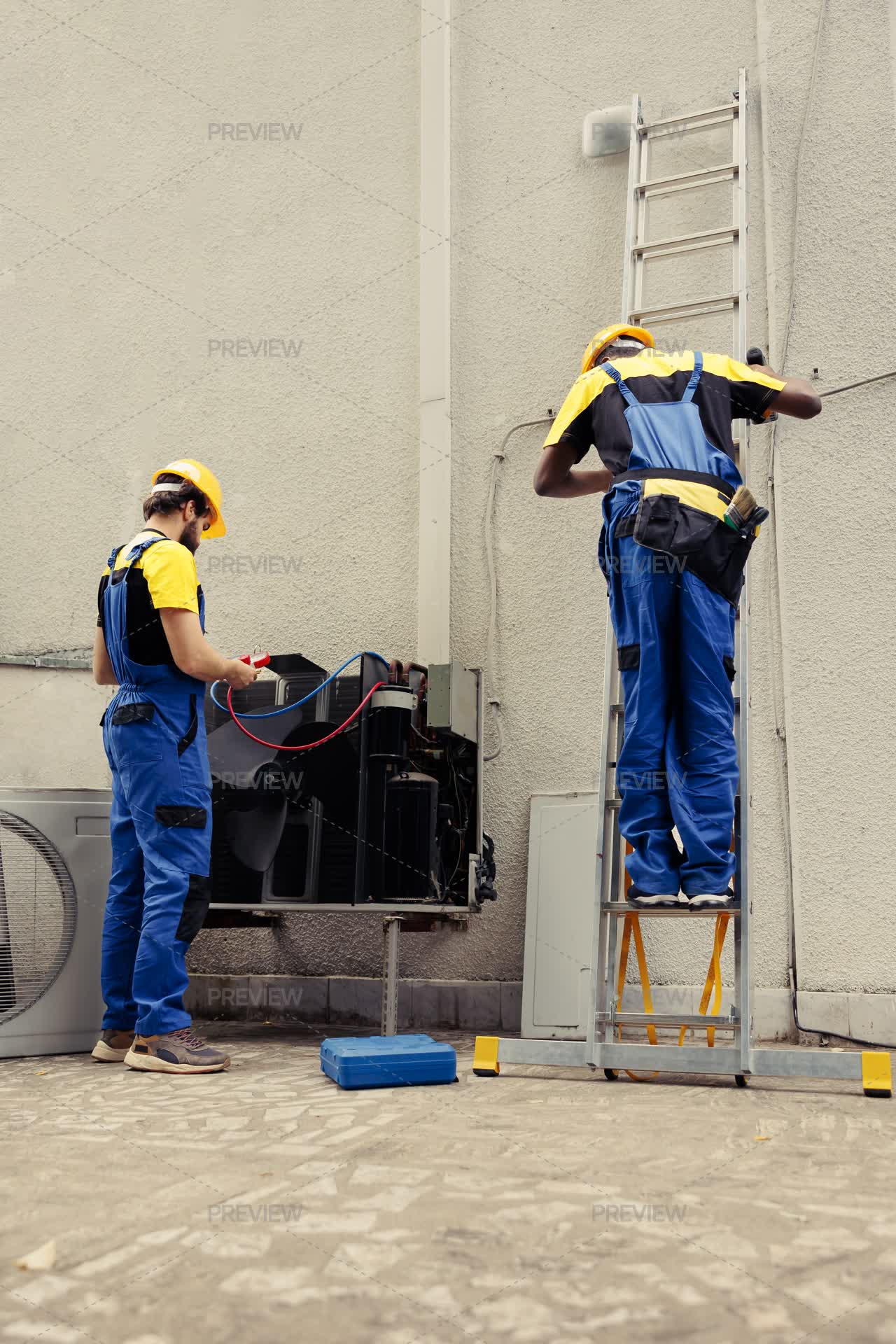 Coworkers Doing Hvac System Checkup Stock Photos Motion Array Coworkers doing hvac system checkup stock photos motion array