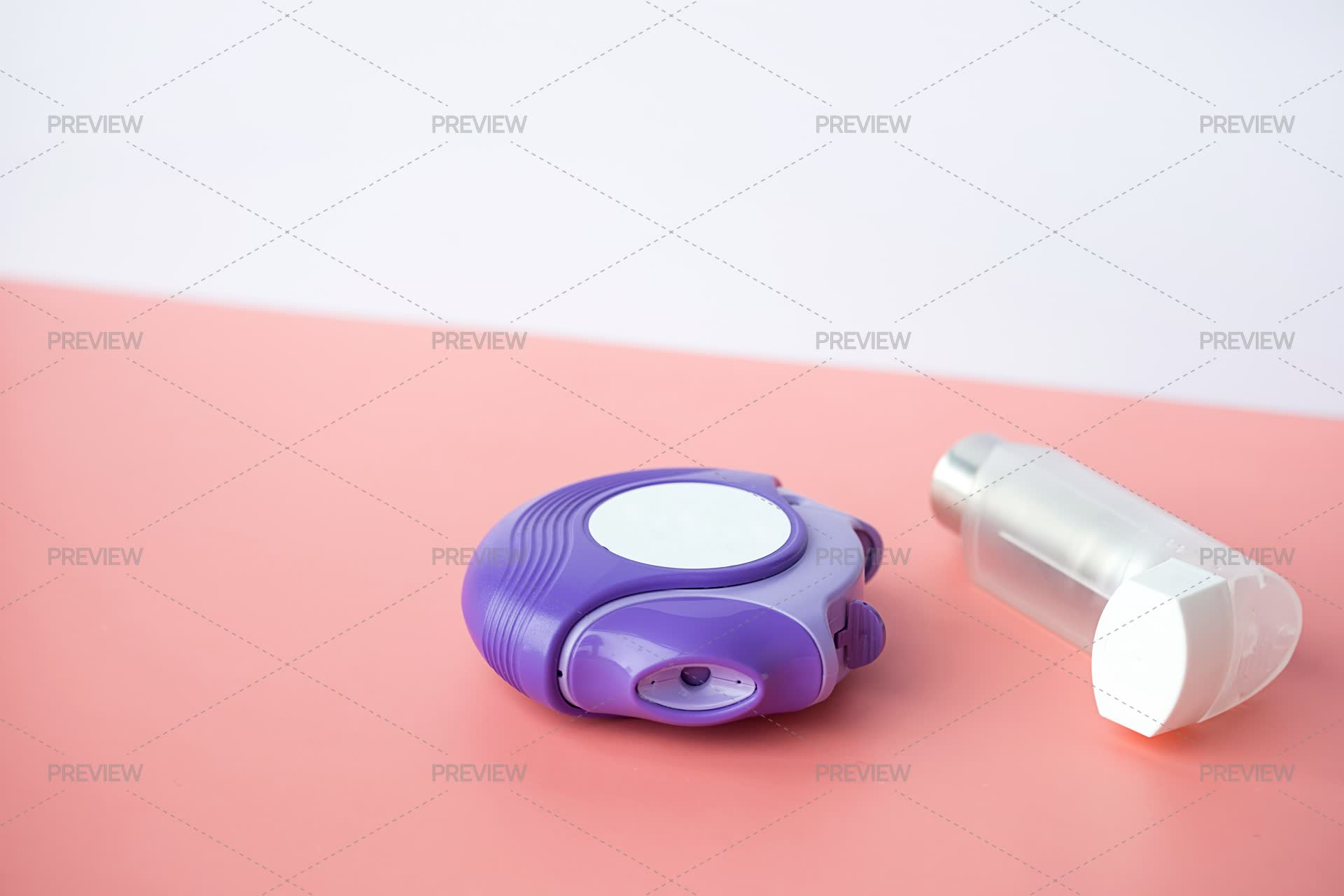 Asthma Inhalers On Pink Surface - Stock Photos | Motion Array
