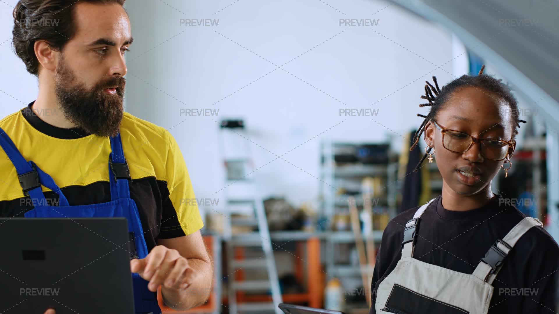 Coworkers Doing Car Maintenance - Stock Photos | Motion Array