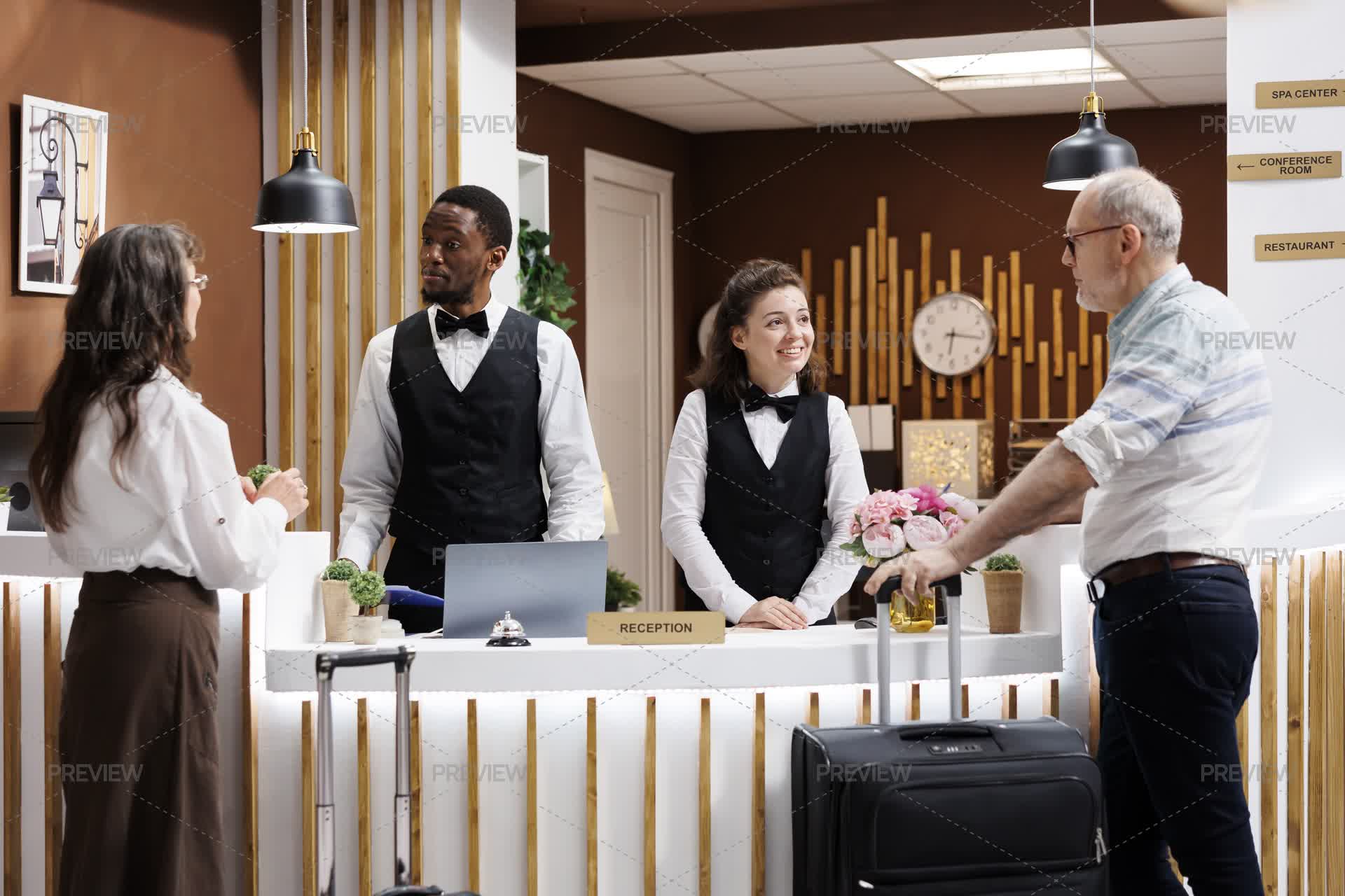 Example Motel Reception Welcoming Guests At Hotel Reception - Stock Photos | Motion Array