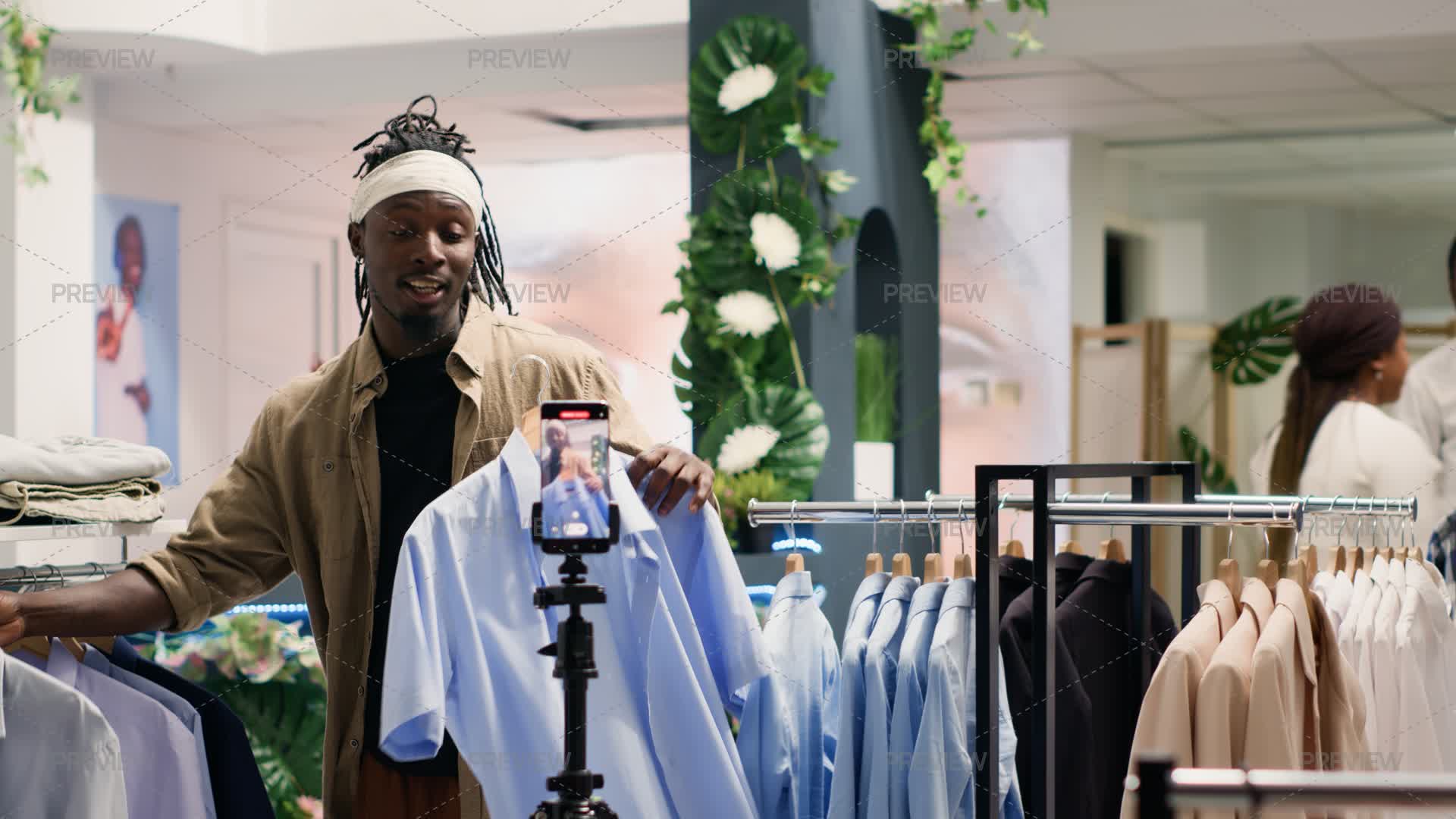 Influencer Advertising Clothes In Store - Stock Photos | Motion Array