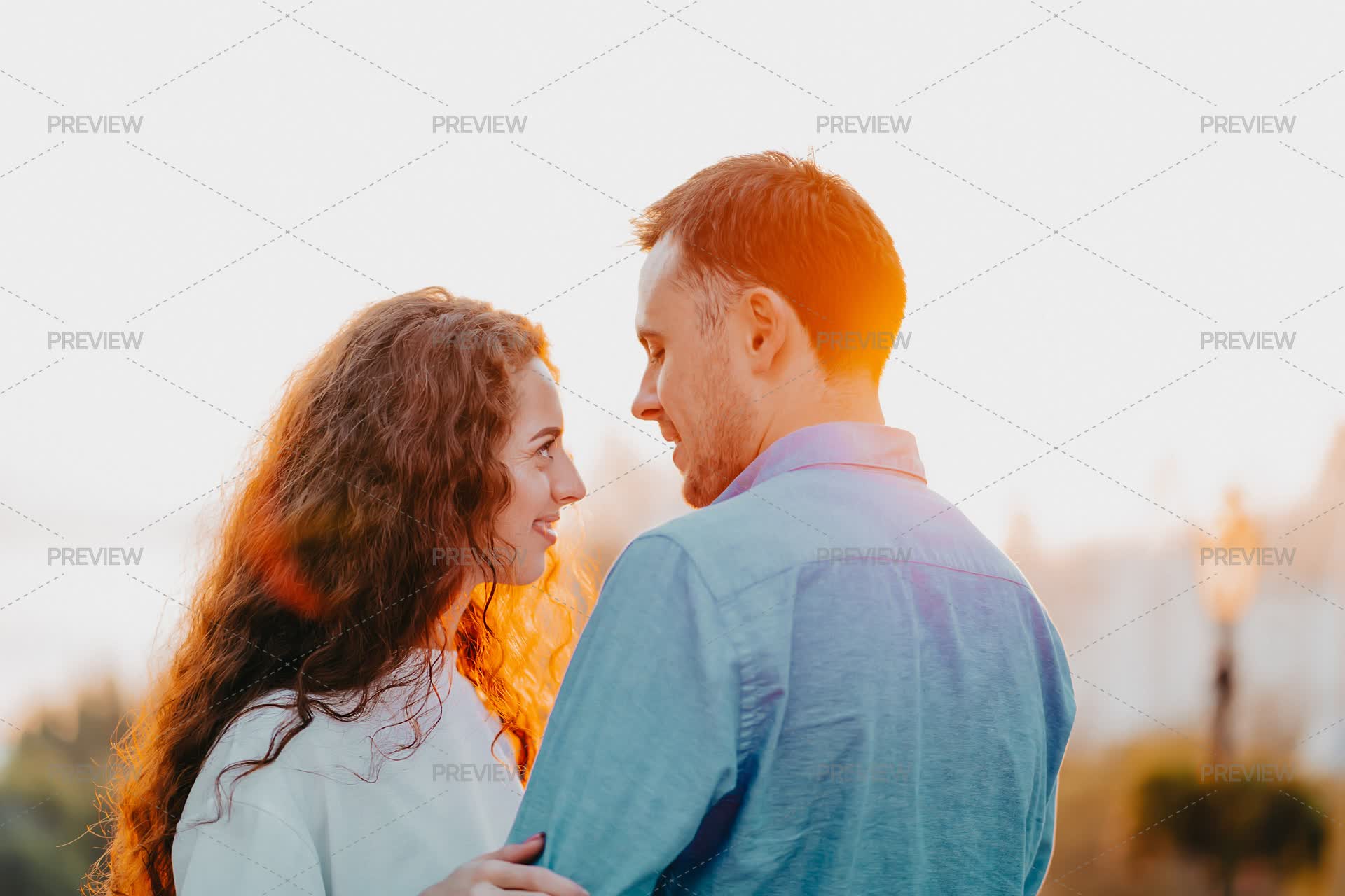 Young Couple Hug In Sunset - Stock Photos | Motion Array