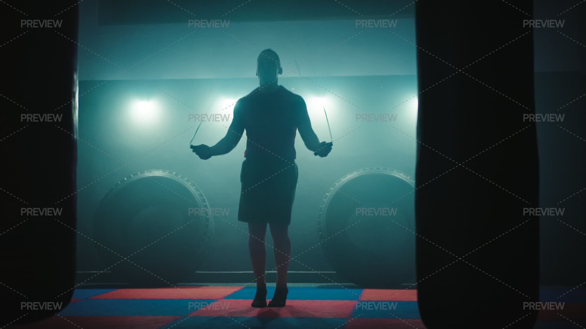 Fighter Performs Exercises Using Jump Ropes - Stock Photos | Motion Array