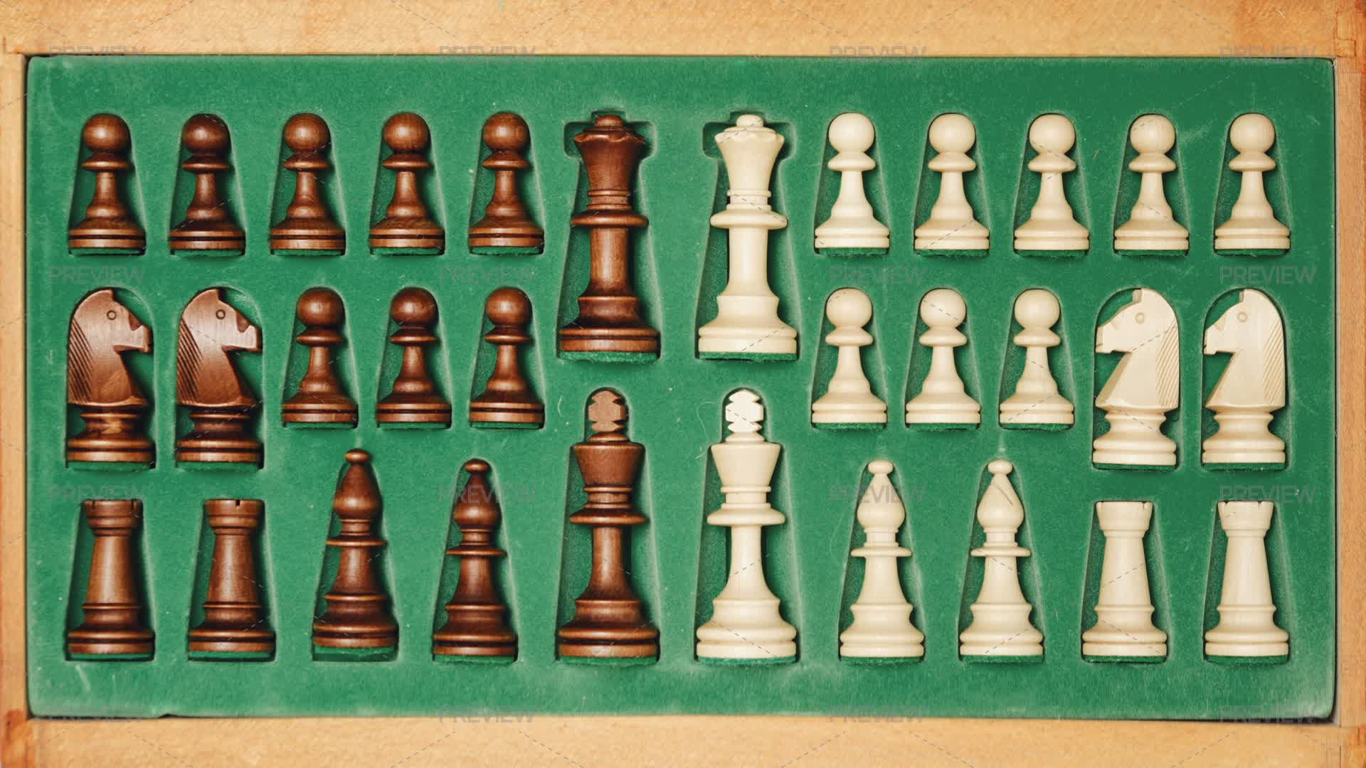 Putting Away Chess Pieces In A Wooden Box Behind The Chessboard - Stock ...
