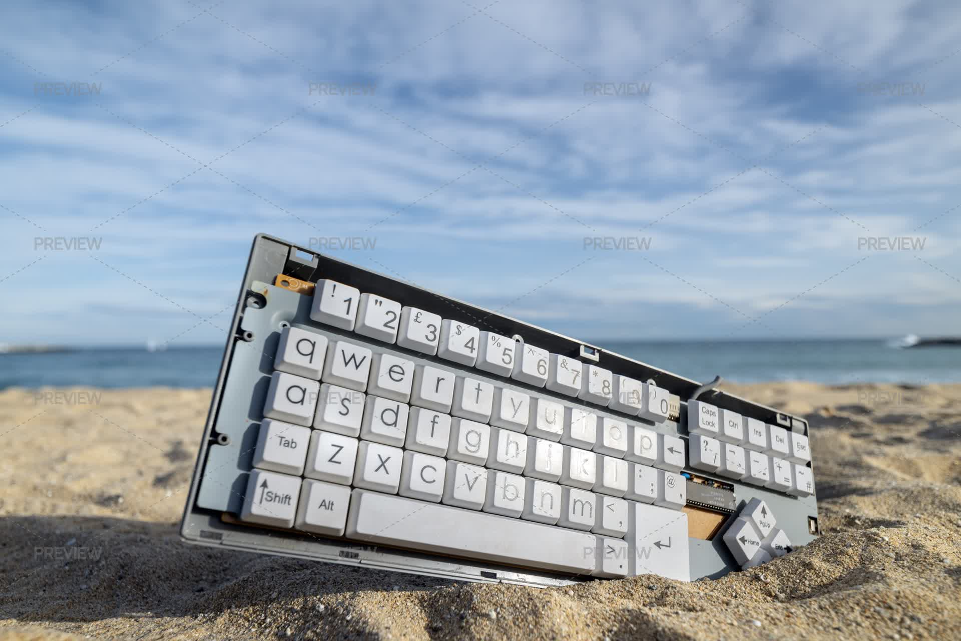 Keyboard In Sand On Beach - Stock Photos | Motion Array