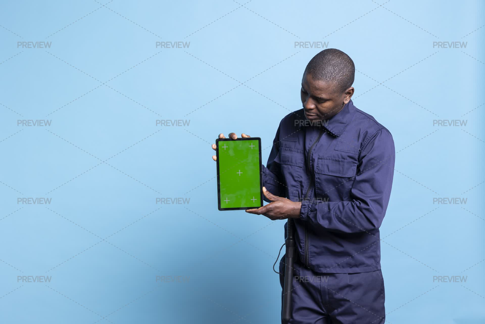 Guard Using Tablet Trained Armed Bodyguard Holds A Tablet With Greenscreen Layout On ...