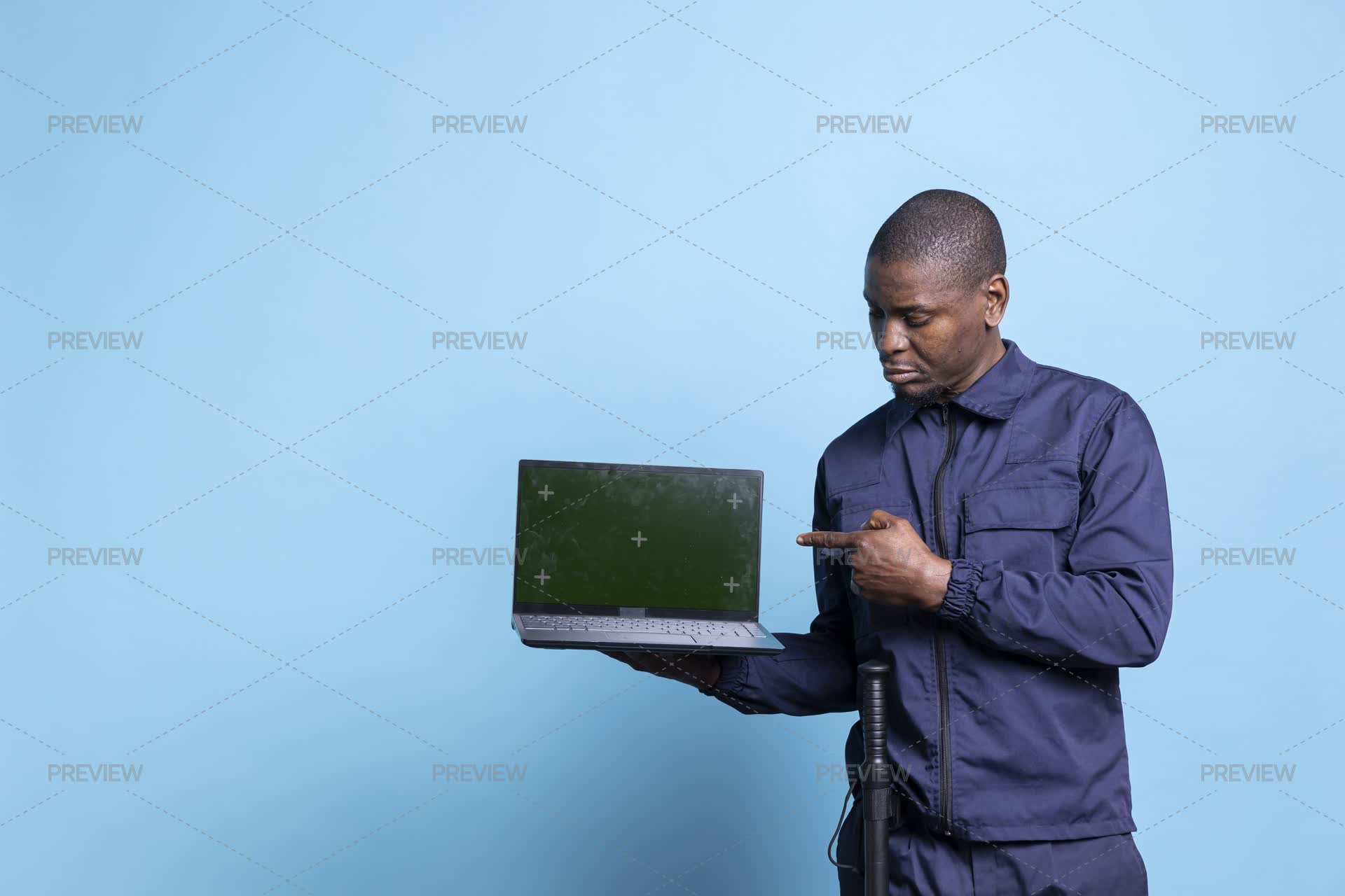 Security Guard Pointing At His Laptop Display With Copyspace - Stock ...