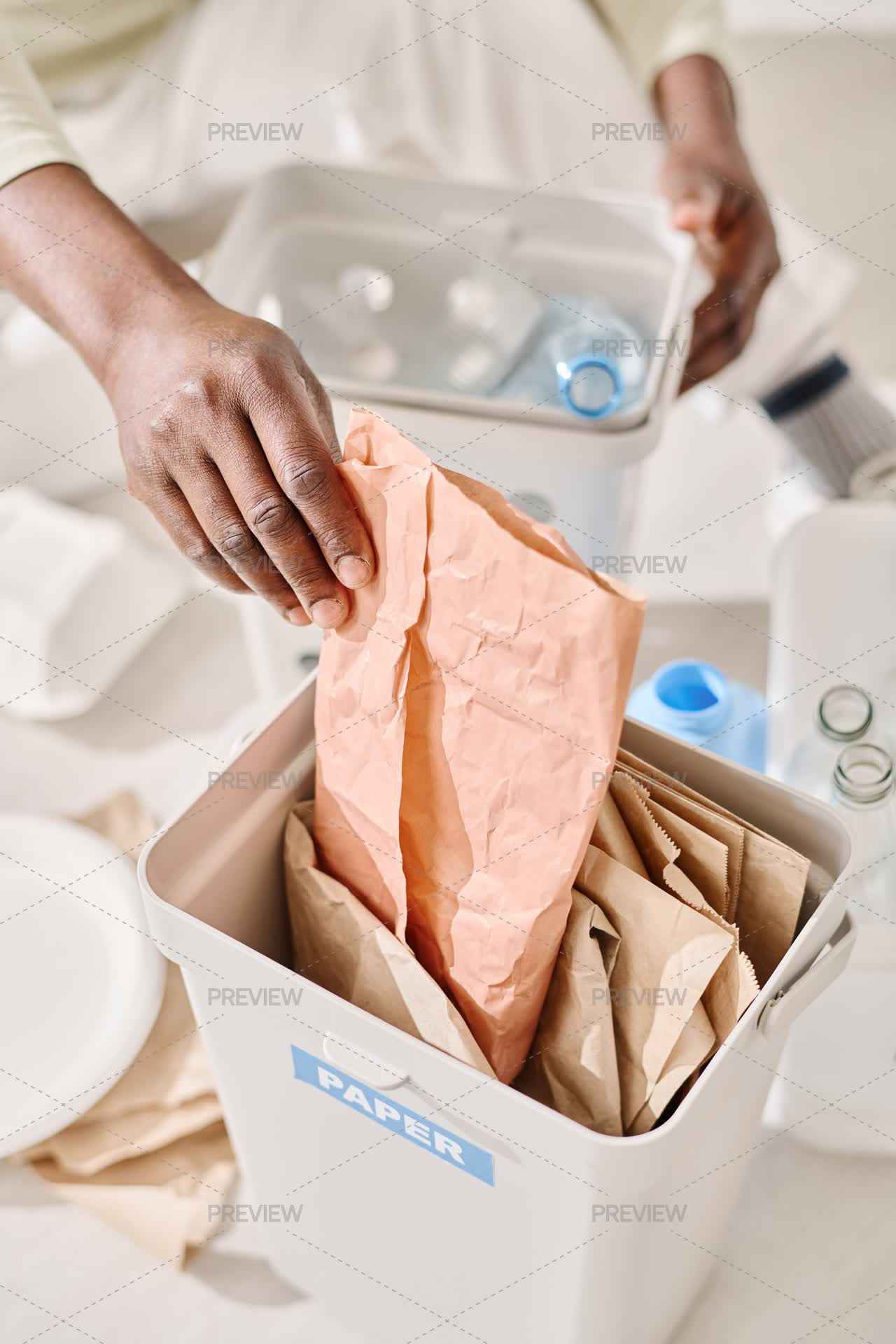 Sort Papers Man Sorting Paper And Plastic In Containers - Stock Photos | Motion Array