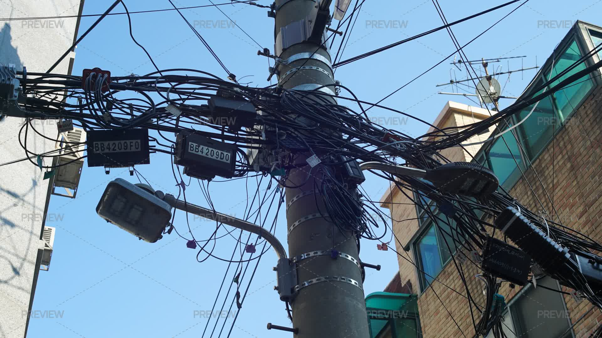 Electric Pole With Tangled Wires In A Residential Area - Stock Photos ...