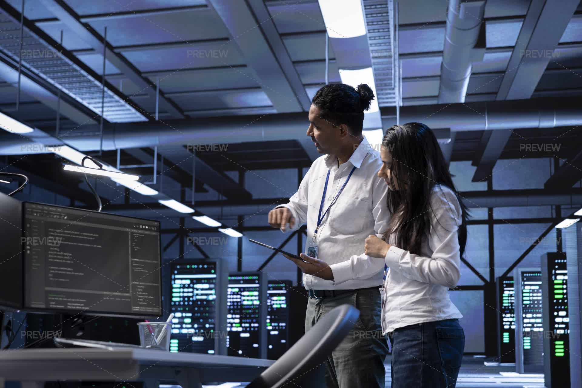 Programmers In Data Center Running System Diagnostic Tests On PC And ...
