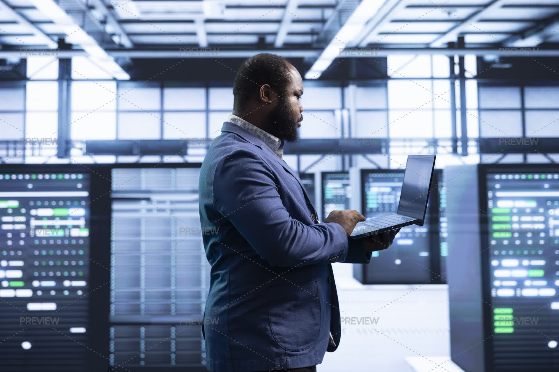 Developer Laptop Protection Software Developer In Server Room Using Laptop To Implement Security ...