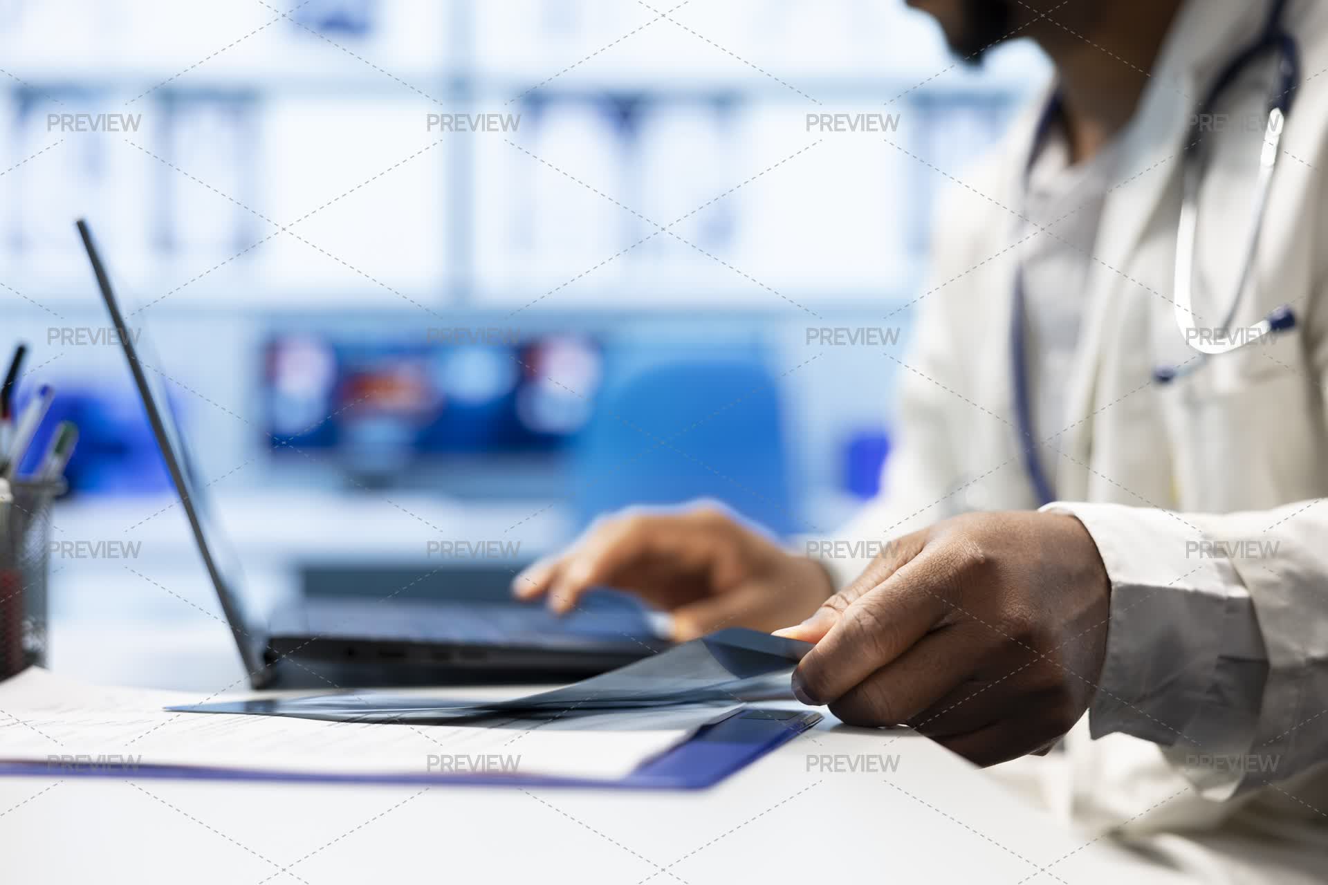 Hospital Docket Doctor Comparing Hospital Records And Test Results In An Office - Stock ...