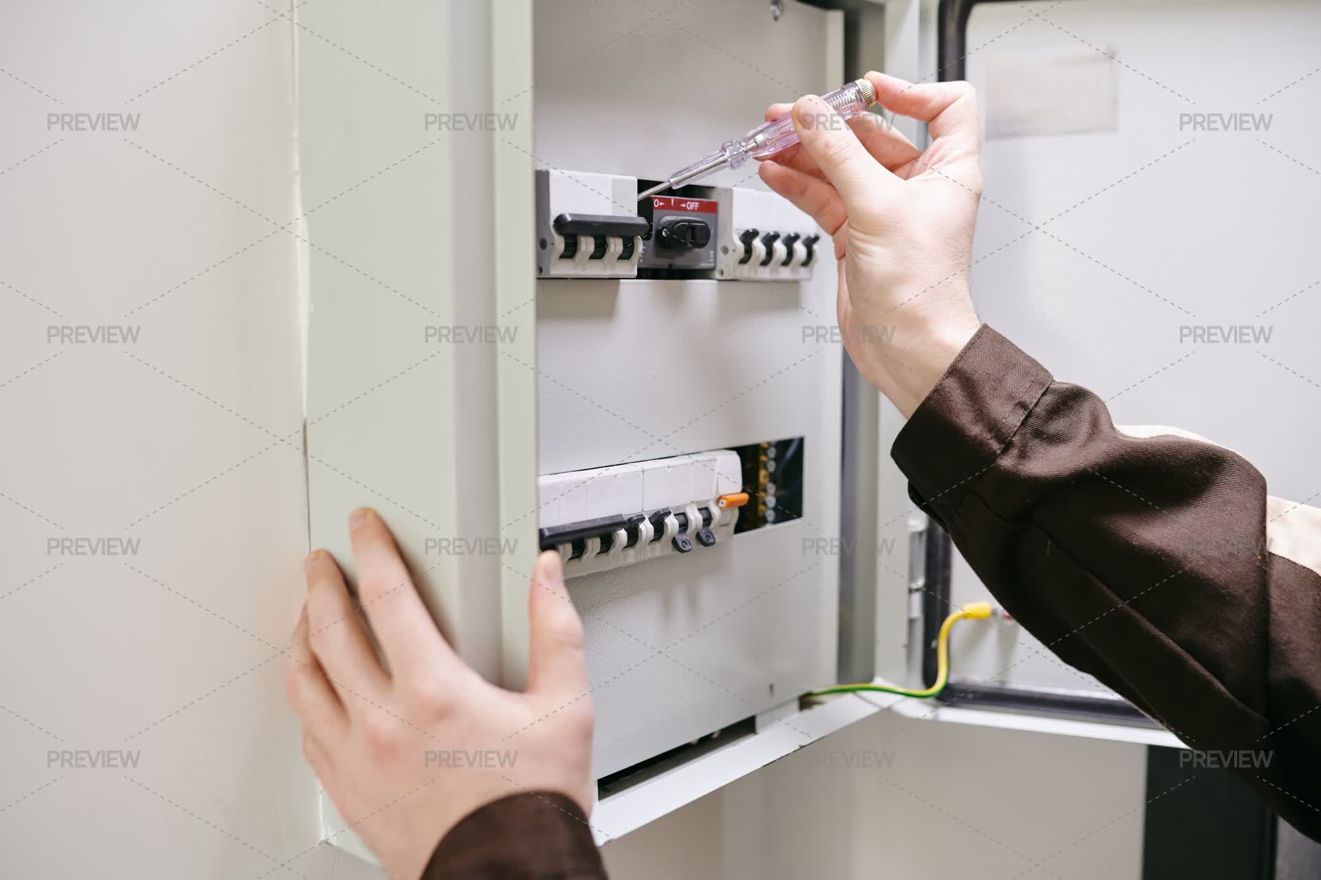 Electrical Current Measuring Gun Hands Of Young Electrician Using Current Measuring Tool - Stock Photos ...