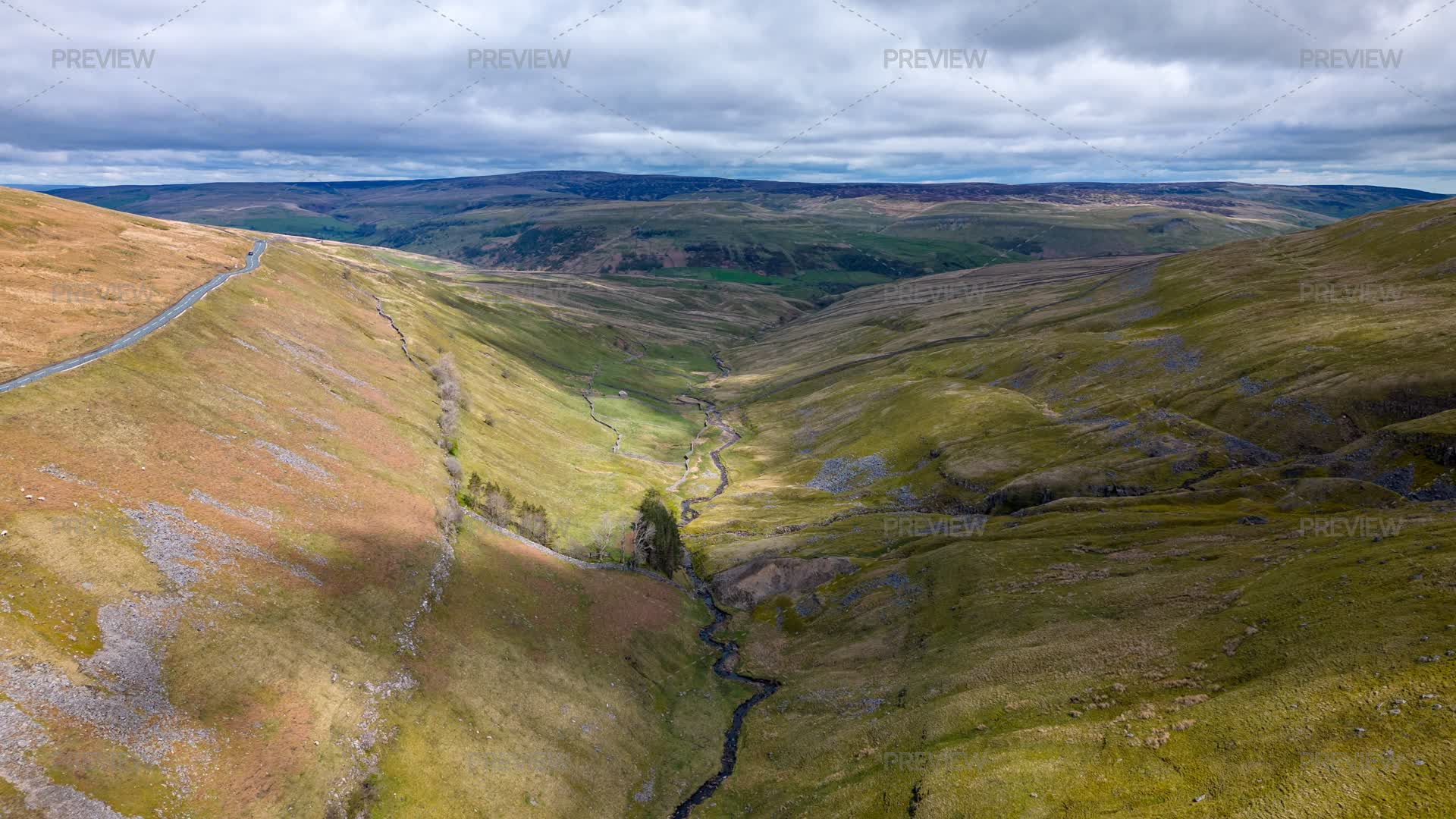 Aerial View Of A Vast, Undulating Landscape With Green Hills - Stock ...