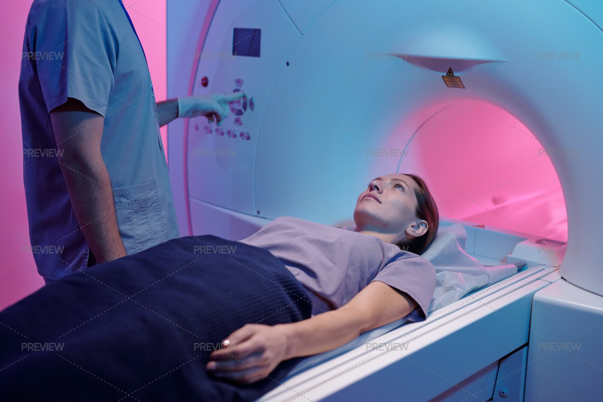 Woman On Medical Table Moving Into MRI Scan Machine - Stock Photos ...