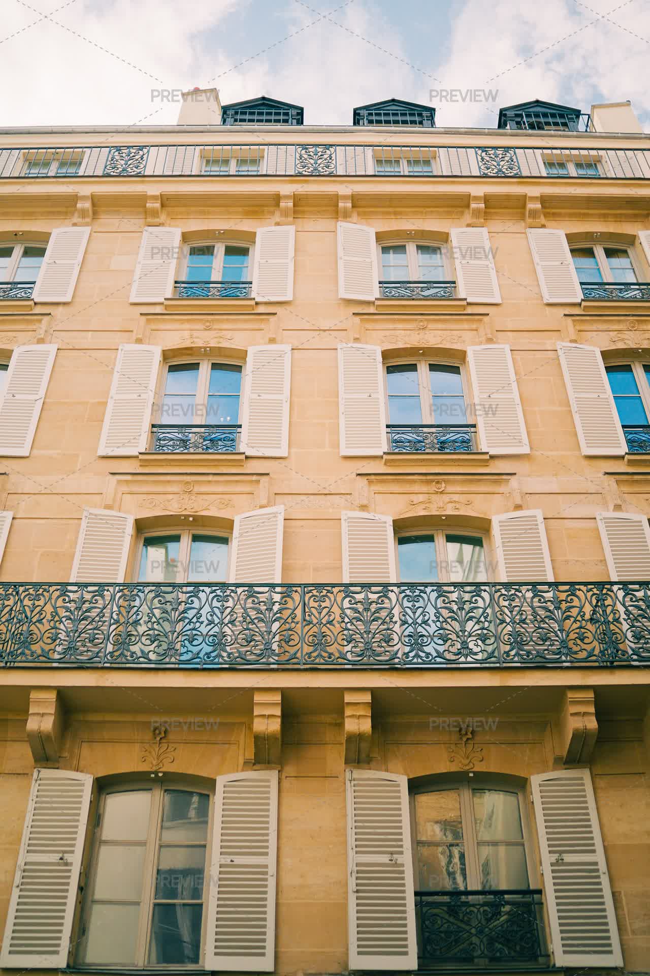 Sandstone Building With Arched Windows And Shutters - Stock Photos ...