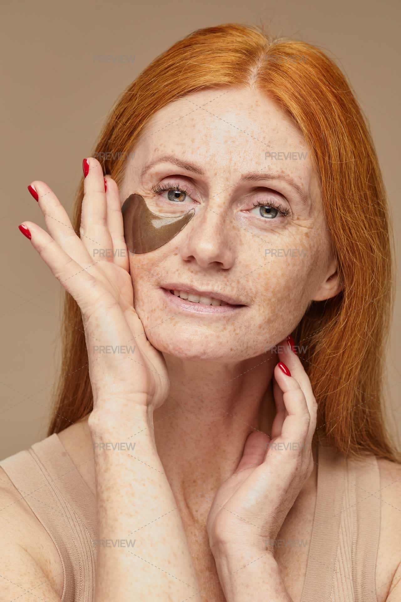 Red Hair Woman Using Patches - Stock Photos | Motion Array