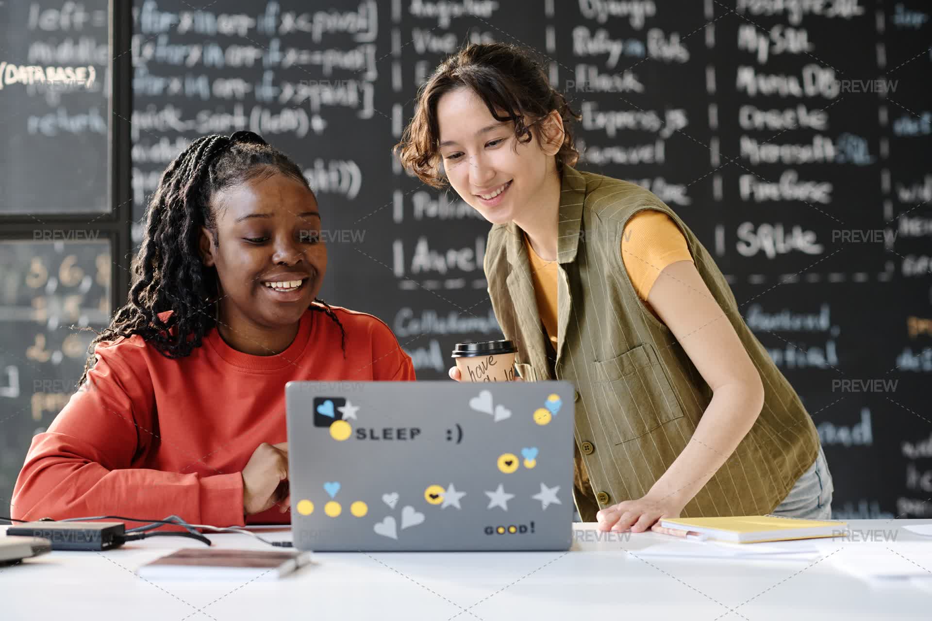 A Tutor Using Technology Tutor Uses Laptop During Lesson With Student - Stock Photos | Motion Array