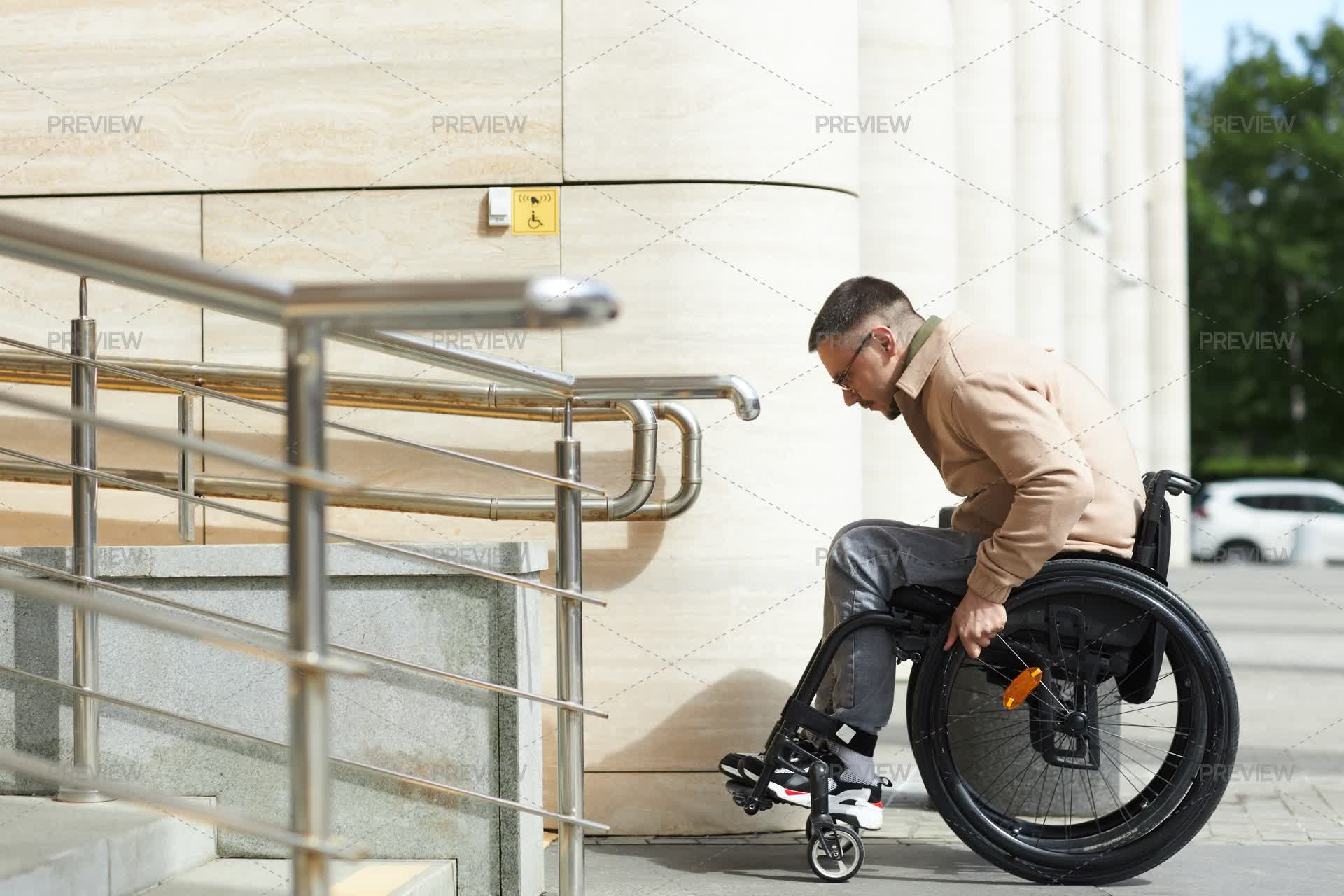 Someone Using A Ramp Man In A Wheelchair Using A Ramp - Stock Photos | Motion Array