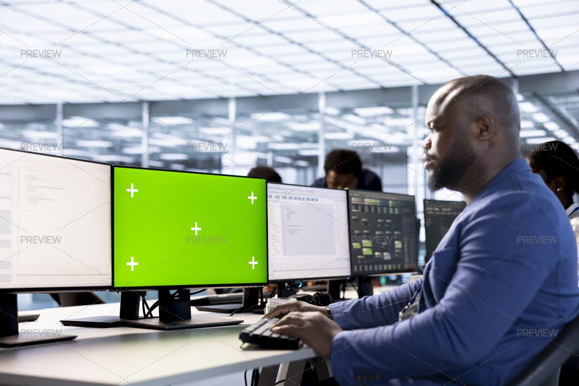 Man In Data Center Updating Systems On Green Screen PC To Protect ...