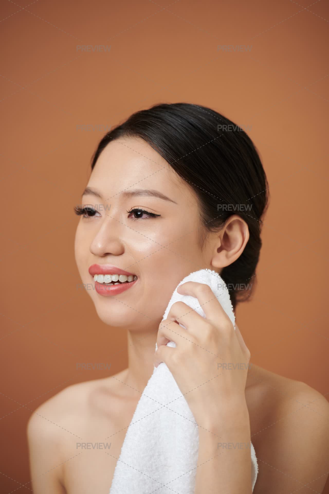 Woman Wiping Her Face With Towel - Stock Photos | Motion Array