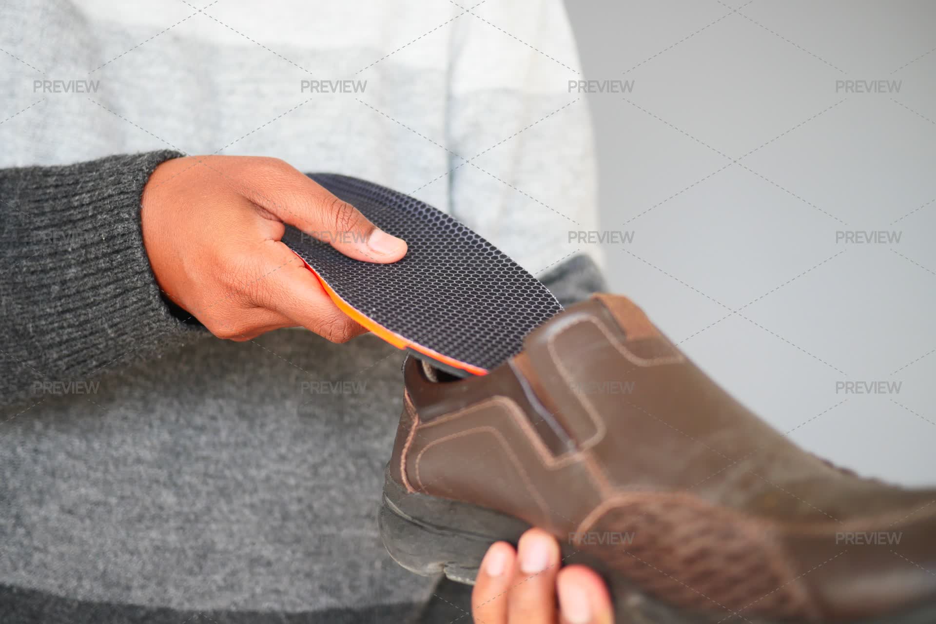 Man Hand Putting Orthopedic Insoles In - Stock Photos | Motion Array