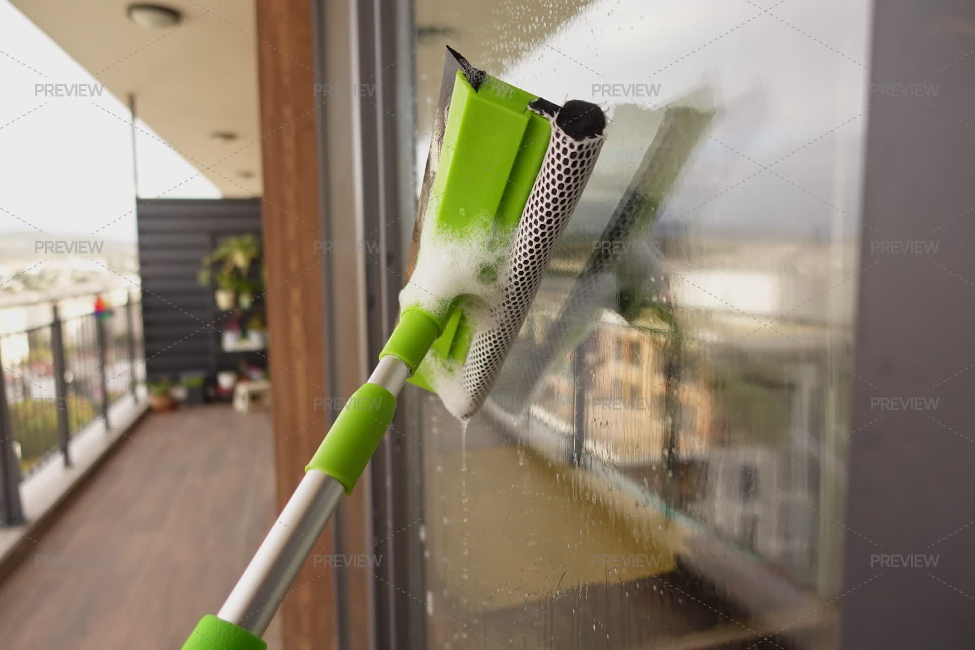 Cleaning Windows With A Squeegee. - Stock Photos | Motion Array