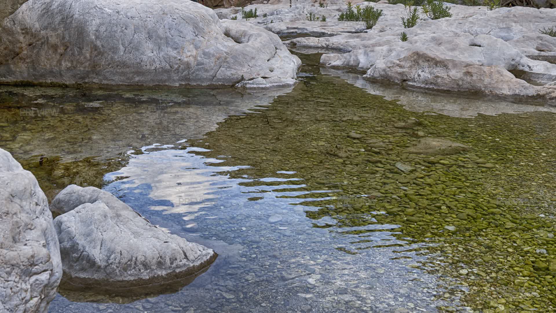 Lumps Of Rocks In Water With Reflection, Canyon - Stock Photos | Motion ...