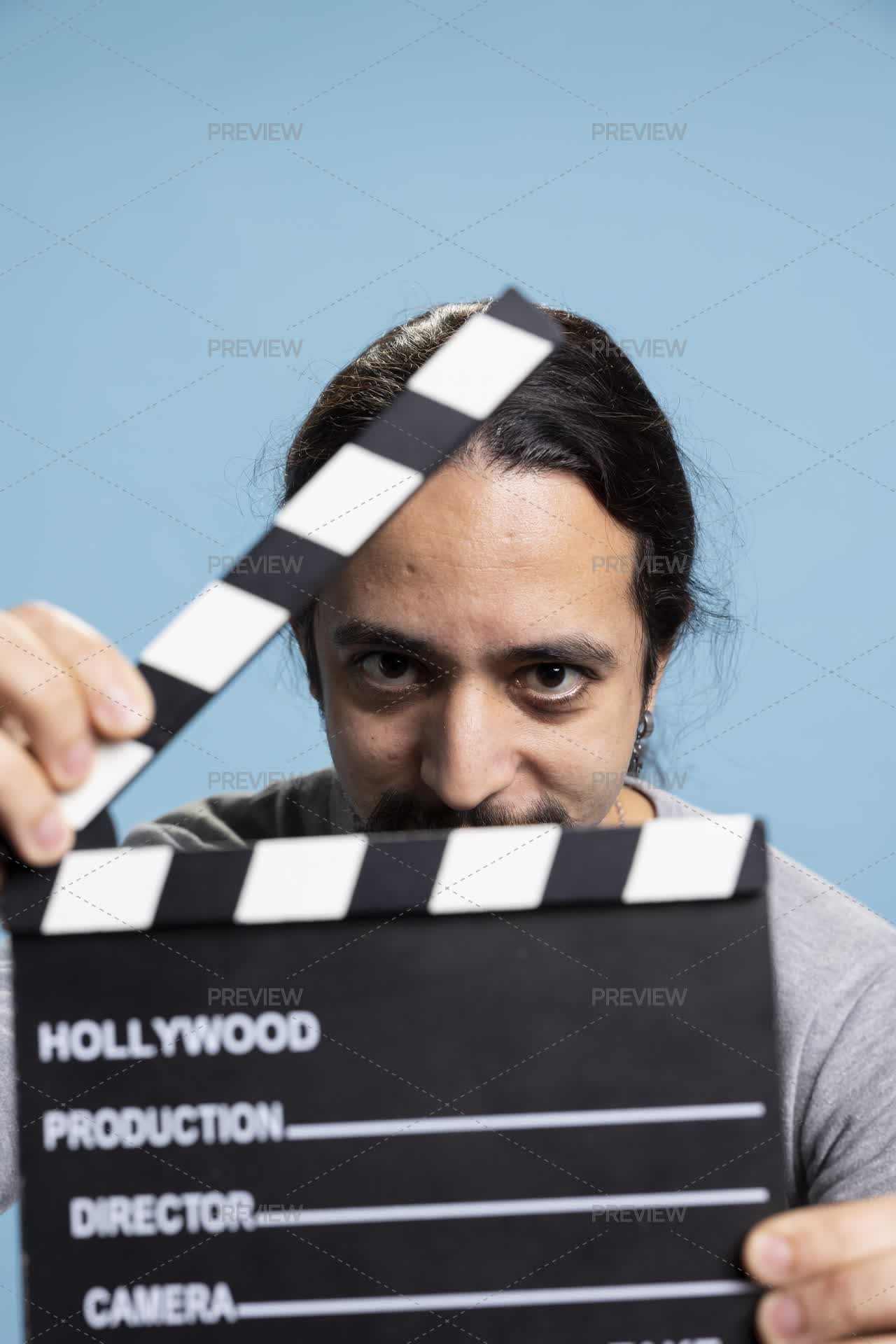 Man Presenting The Clapper Board On Camera When Filming - Stock Photos ...