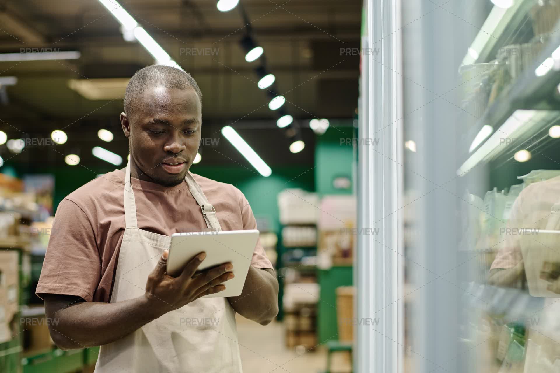 Worker Using Tablet Computer Supermarket Worker Using Tablet PC At Work - Stock Photos | Motion Array