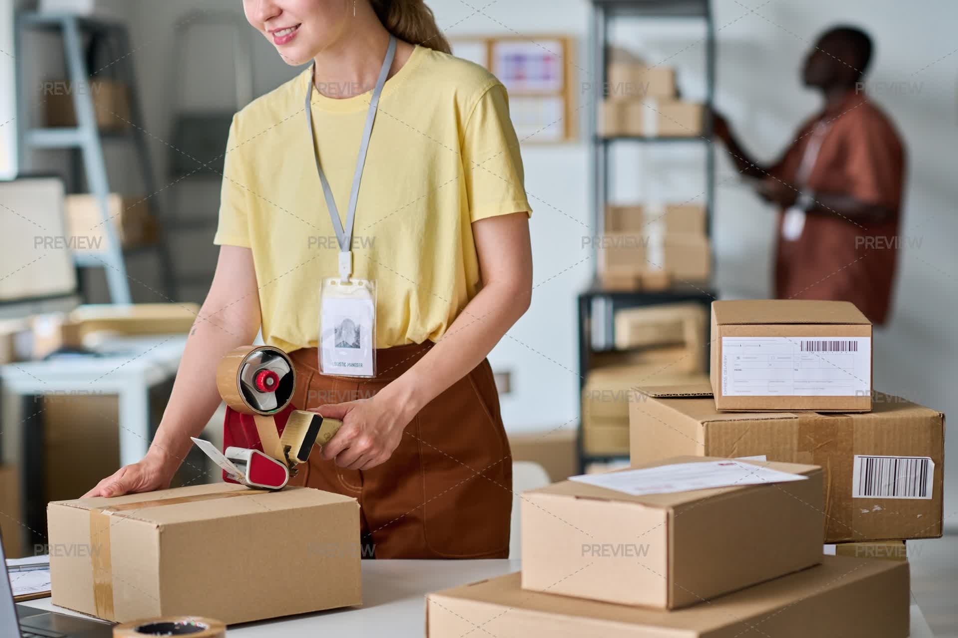 Packing Manager Close-Up Of Female Manager Packing Parcel For Delivery - Stock Photos ...