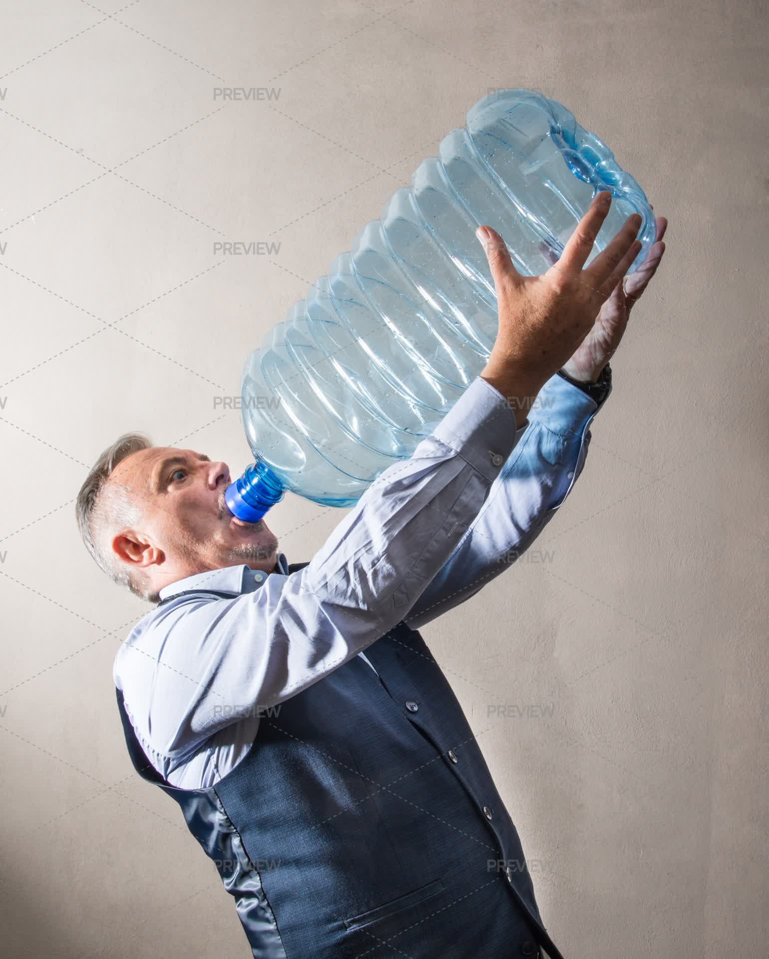 Drinking From A Giant Water Bottle - Stock Photos | Motion Array