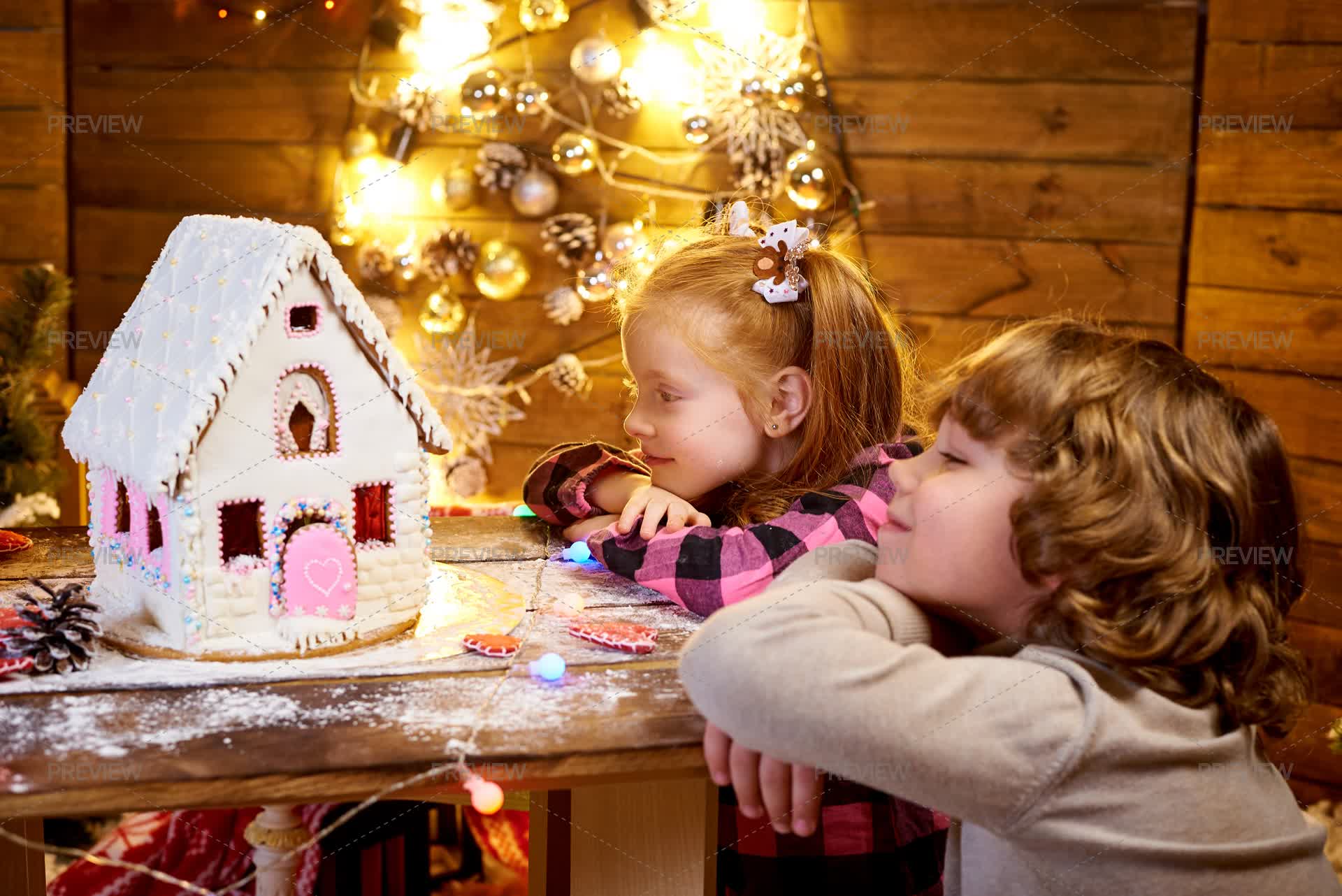 Admiring Gingerbread House - Stock Photos | Motion Array